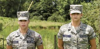 Civil Air Patrol Cadets 1st Lt. Davis Laughlin and 2nd Lt. Justin Oakes on the scene of accident; pond is behind them. Photo/Diane Gentzke.