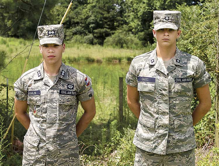 Civil Air Patrol Cadets 1st Lt. Davis Laughlin and 2nd Lt. Justin Oakes on the scene of accident; pond is behind them. Photo/Diane Gentzke.