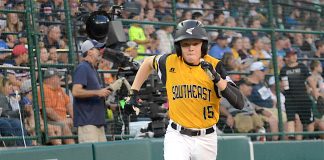 Peachtree City’s Connor Riggs-Soper runs home after reaching base with a double during the second inning of a Little League World Series game against the Mid-Atlantic. Photo/Brett R. Crossley.