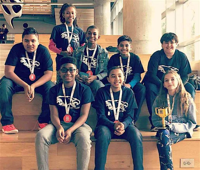 Team I.C.E. shows off their medals and trophy awarded to them for winning the research award at the Georgia First Lego League State Championship held at Georgia Tech. (L-R) Back Row: Michael Baksh, Bre’Yon Guidry, Tyson White, Darion Nandial, Jaden Torres; Front Row: Nicholas Jenkins, Dylan Felker, and Madison Lohr. Photo/Fayette County School System.