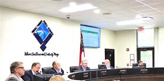 Seated at the dais at the Sept. 9 meeting of the Fayette County Board of Education were, from left, board members Brian Anderson and Barry Marchman, Superintendent Jody Barrow, Chairman Scott Hollowell and board members Roy Rabold and Leonard Presberg. Photo/Ben Nelms.