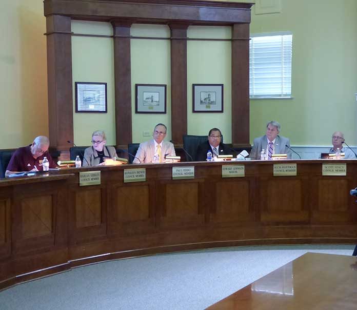 Members of the Fayetteville City Council at the Sept. 19 meeting were, from left, council members Harlan Shirley, Kathaleen Brewer and Paul Oddo, Mayor Ed Johnson and council members Rich Hoffman and Scott Stacy. Photo/Ben Nelms.