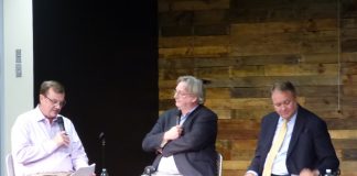 Moderator Steve Brown, at left, was joined by Fayette County Board of Education Chairman Scott Hollowell and school board member Barry Marchman for a Sept. 10 meeting with parents at The Bridge Community Center in Peachtree City. Photo/Ben Nelms.