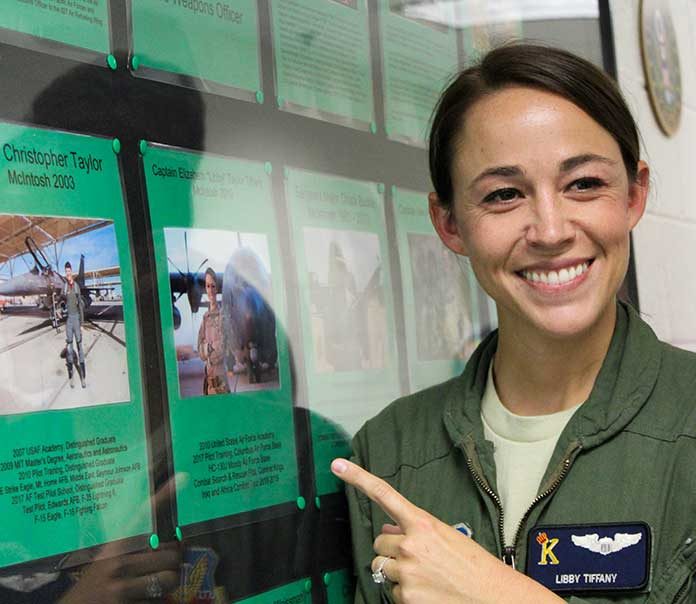 Capt. Elizabeth “Libby” Tiffany points out her photo on the Wall of Honor at her alma mater, McIntosh High School. Photo/Samantha Cornett.