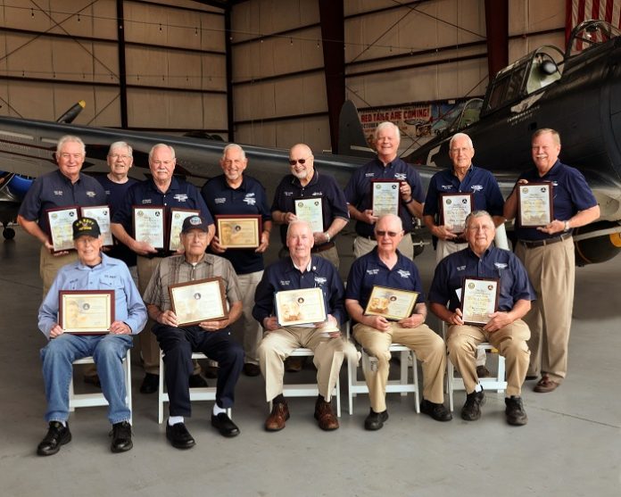 Three CAF Dixie Wing members honored this month for more than 50 years each of service as pilots and mechanics were joined by 10 previous winners from the Dixie Wing. The entire group gathered at the Dixie Wing Warbird Museum to show the depth of experience within the Dixie Wing membership. From left, back row are: Tony Stein, John Flynn, Jim Buckley, Charles Kennedy, Elmer Koldoff, Ric Carlson, Willard Womack and Andy Anderson. Front row, from left, are: Willie Dickerson, Bill Baldwin, Ron Gause, George Harrison and Ray 