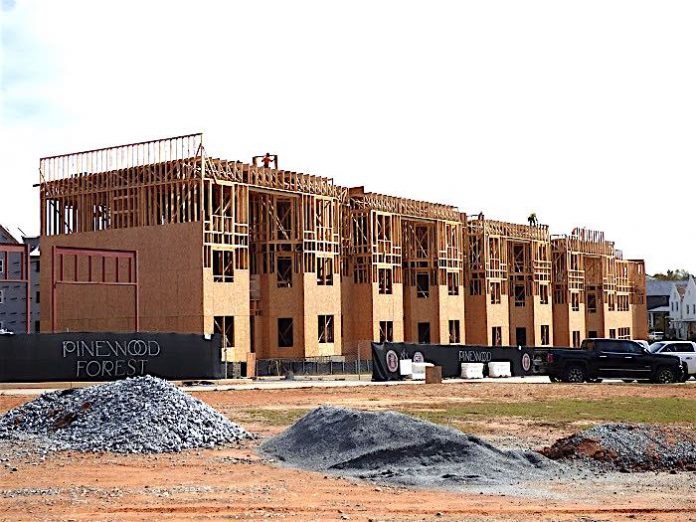 Work on three large commercial/residential buildings in the Town Center area of Pinewood Forest in Fayetteville is underway. Photo/Ben Nelms.