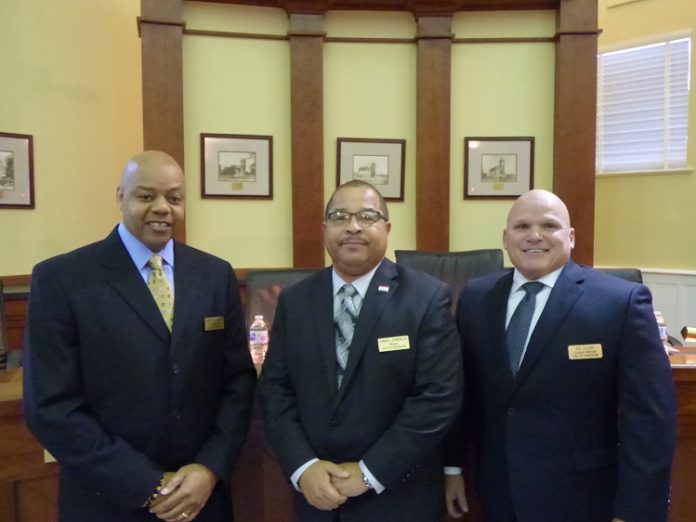 Sworn in on Jan. 9 were, from left, Fayetteville Councilman Darryl Langford, Mayor Ed Johnson and Councilman Joe Clark. Photo/Ben Nelms.