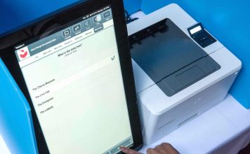 Georgia voter makes a selection in a test of the state's new voting machines. Photo/Ga. Secretary of State.