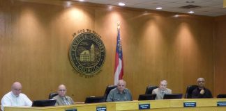 Voting to close Fayette County government offices to the public through March 27 were, from left, commissioners Eric Maxwell and Edge Gibbons, Chairman Randy Ognio and commissioners Chuck Oddo and Charles Rousseau. Photo/Ben Nelms.