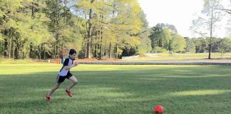 Matt Mazzanti, 14, practices his soccer skills in an empty field.