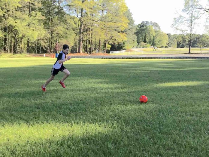 Matt Mazzanti, 14, practices his soccer skills in an empty field.