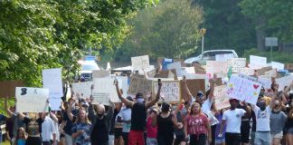 A group of 400 people protesting the loss of black lives to law enforcement marched along Ga. Highway 54 in Peachtree City during the afternoon hours of June. 2. The peaceful protest began at The Avenue and ended at City Hall Plaza. Photo/Ben Nelms.