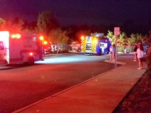 2 dead after car crashes through theater fence i...