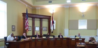 Members of the Fayetteville City Council at the July 2 included, from left, councilmen Darryl Langford, Joe Clark and Paul Oddo, Mayor Ed Johnson and councilmen Rich Hoffman and Scott Stacy. Photo/Ben Nelms.