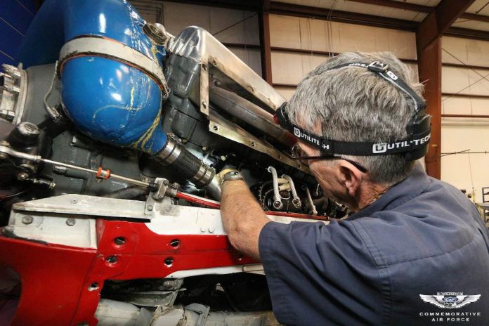 A CAF Dixie Wing volunteer works on one of the vintage aircraft at the hangar at Falcon Field in Peachtree City. Photo/CAF Dixie Wing.