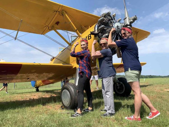 Female members of the CAF Dixie Wing taking part of the restoration. In the rear cockpit Robyn, front cockpit Alisa Lockwood and Robin O’reilly standing by the airplane. Photo/Submitted.