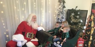 Fayetteville residents Parker Bryan, 5, (at left), Ali Bryan, 9, and J.T. Bryan, 2, were at Trilith in Fayetteville on Dec. 5 to spend time with Santa. Photo/Ben Nelms.