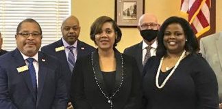 Being recognized by the Fayetteville City Council were Naihal Grant McFarlane (2nd from left) and Rhonda B. Kreuziger (at right). Photo/City of Fayetteville.