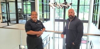 Fayetteville Mayor Ed Johnson and City Manager Ray Gibson stand in the atrium of the new City Hall. Photo/City of Fayetteville.