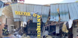 Look closely to see a dump truck inside an antique store on Ga. Highway 85 North in Fayetteville. The truck crashed through the front of the building Thursday morning. Photo/Fayetteville Fire Department.