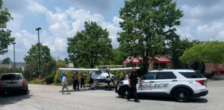 Peachtree City Police on scene of forced landing of aircraft on Hwy 54 East at Publix_E