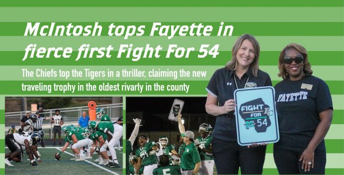 In the graphic above, at left, the Tigers (black helmets) lined up against the Chiefs in the annual renewal of the county’s oldest sports rivalry. At center, McIntosh head football coach Lee Belknap and the Chiefs celebrate their thrilling 34-28 win over the Tigers. At right, McIntosh High Principal Maggie Walls and Fayette County High Principal Yolanda Briggs-Johnson unveil the new “Fight For 54” trophy for their schools’ football rivalry game. Photos/Chris Dunn, public information specialist, Fayette County School System.