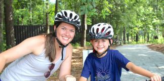 Maddie Burke and campers learn to ride bikes on the camp's brand new bike and pump track.