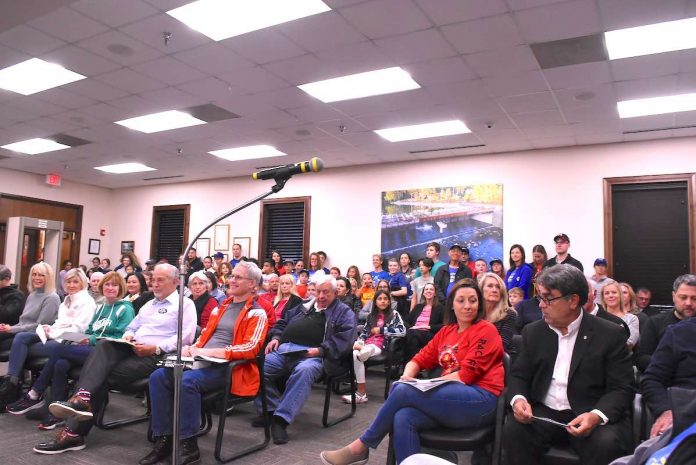 Crowd awaits action by the Peachtree City Council. Photo/Cal Beverly.