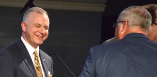 Newly elected president Josh Saefkow walks off the stage after his election as president was announced by outgoing president Kevin Williams, right, at the 200th annual meeting of the Georgia Baptist Convention in Augusta, Ga, Tuesday, Nov. 15, 2022. Photo/Index/Henry Durand.