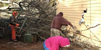 Volunteers from Georgia Baptist Disaster Relief remove storm debris from a home in Griffin. Tornadoes caused damage across much of the state last week. Photo/The Christian Index.