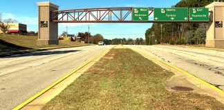 A potential bridge design is superimposed on a view of Ga. Highway 74 North looking northward toward the Hwy. 54-74 intersection.