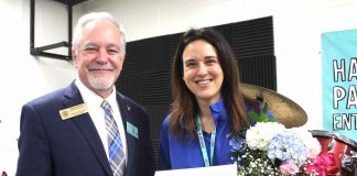 State School Superintendent Richard Woods presents Christy Todd, a music technology teacher at Rising Starr Middle, with a certificate naming her one of 10 finalists for Georgia Teacher of the Year. Photo/Fayette County School System.