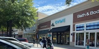 An alert citizen provided Peachtree City police with this candid photo of the robbery suspects running from the store to their getaway vehicle. Photo/Peachtree City Police Facebook page.