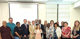 State Court Judge Jason Thompson (center in light suit)stands with interns and visitors. Photo/Fayette State Court.