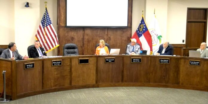 Peachtree City Attorney Ted Meeker (L) explains a point of law to City Manager Bob Curnow, Mayor Kim Learnard, and council members Phil Prebor, Clint Holland and Frank Destadio. Photo/from video of council meeting.