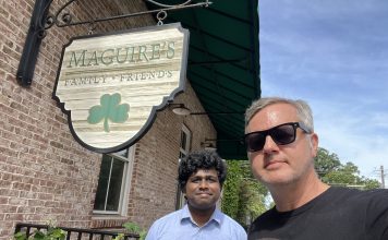 Country Fried Creative owner Joe Domaleski (right) with GSU Data Science Intern Vinay Revanuru in front of Maguire's Irish Pub, one of the subjects of their AI research. Photo/Joe Domaleski