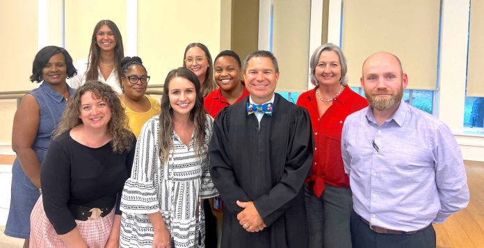 Fayette State Court Judge Jason Thompson (center in black robe) and the DUI Court team observe National Recovery Month during September. Photo/Submitted.