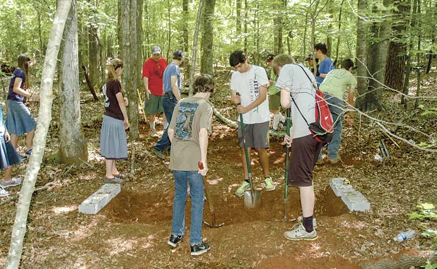 Volunteers clear trail, build bridge for Ridge N...
