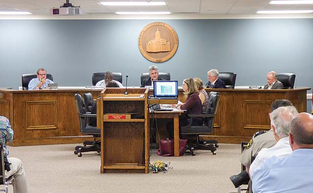 Coweta lowers millage on some, but taxes still i...