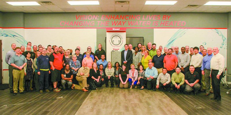 Employees celebrate 2 millionth tankless water h...
